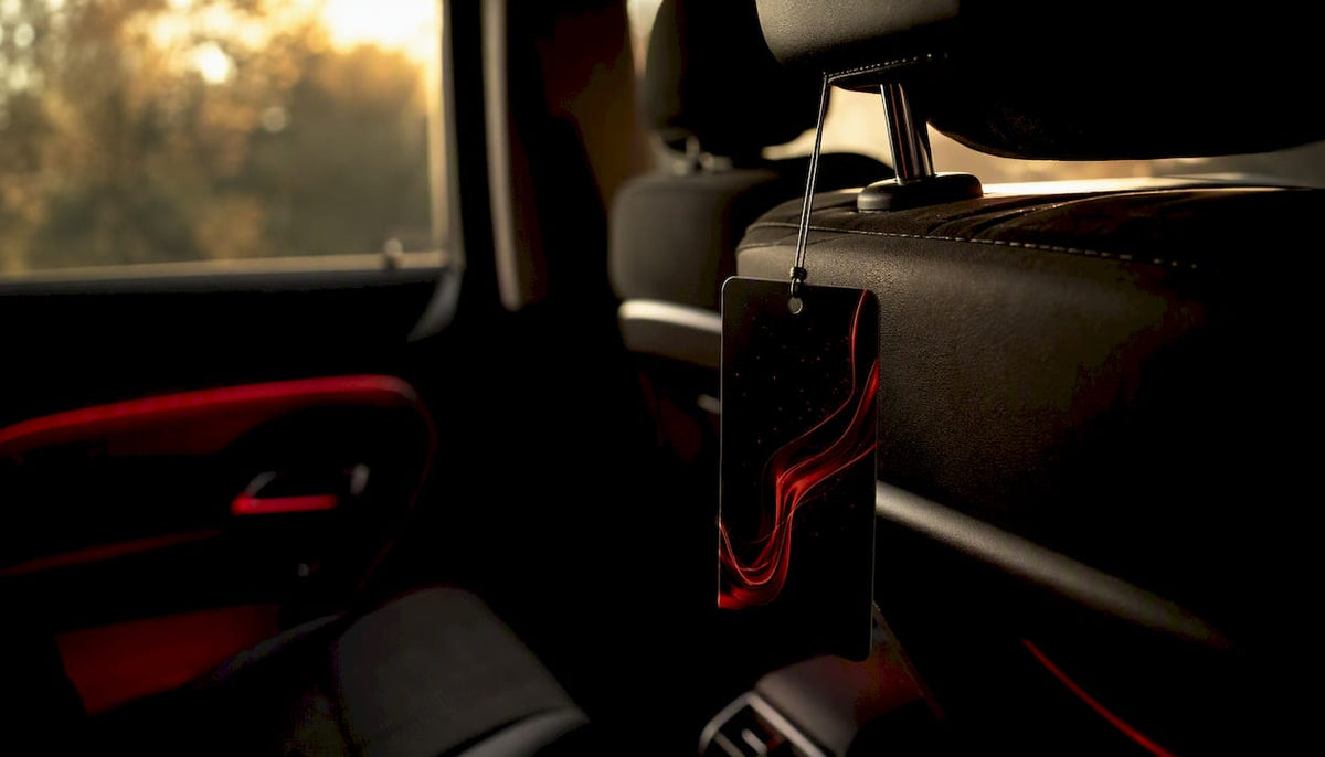 Voidescent scent hanger on passenger headrest post