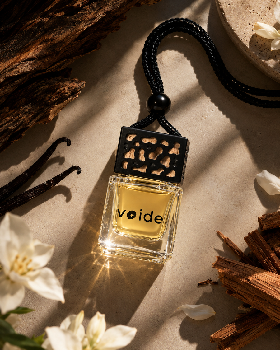 Heavens car fragrance bottle with sandalwood, vanilla pods and white flowers
